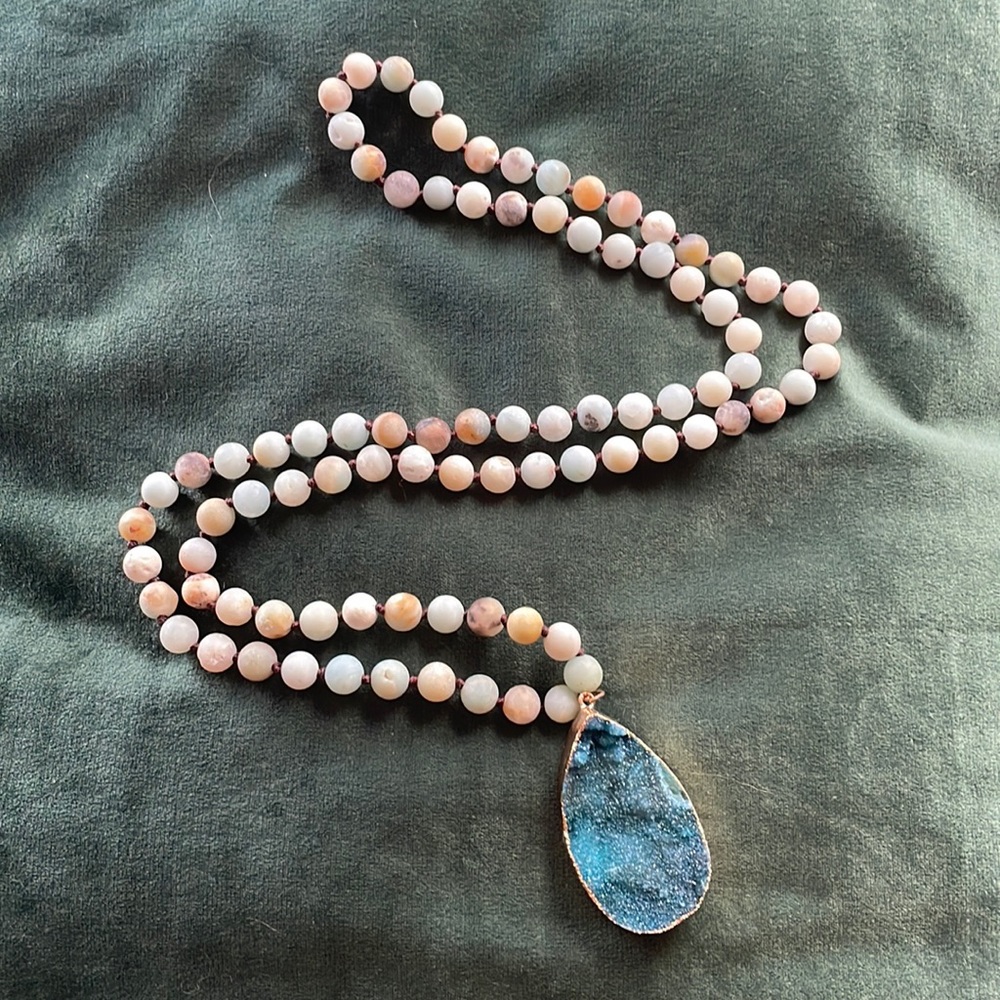 Long beaded necklace with large stone pendant